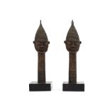 TWO BRONZE FINIALS Two short shafts with carved decoration are topped with bearded male heads