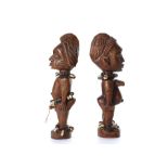 TWO YORUBA IBEJI TWIN FIGURES, NIGERIA One male and one female figure, carved in Ibeji wood, both