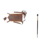 A LEATHER SADDLE BAG AND STAFF Possibly from Ethiopia, the saddle bag, probably for a camel, has