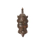 A BAULE MASK, IVORY COAST Of elongated form with almond-shaped eyes with hollow slits, a long