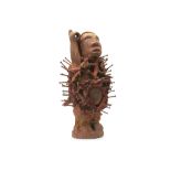 WEST AFRICAN FETISH DOLL The wood figure is depicted with a raised arm, possibly once holding a