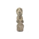 A STONE NOMOLI FIGURE, SIERRA LEONE With a stylised squat body, the figure is depicted in a
