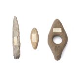 A GROUP OF PREHISTORIC IMPLEMENTS  Including a long narrow grey flint dagger that tapers to a