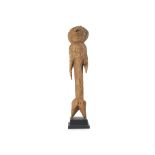 A WOOD MOBA TCHITCHIRI FIGURE, TOGO Of light highly textured wood, In the form of a highly