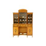 A good satinwood and floral marquetry breakfront bookcase