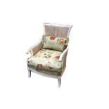 A white painted bergere open arm chair