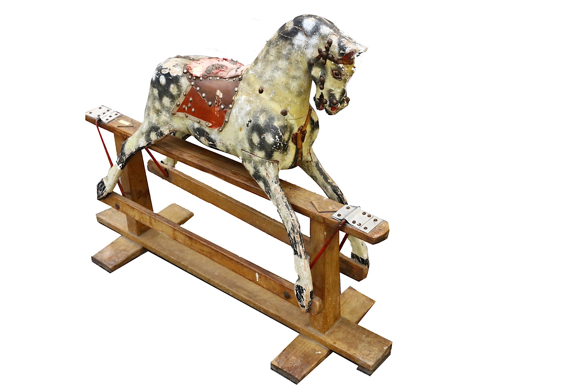 A small carved wood dapple grey rocking horse