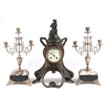 Two French spelter figural clock garnitures