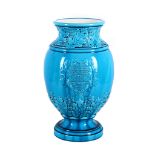 An unusual Burmantofts faience turquoise glazed water filter