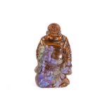 A Chinese carved Tigers-eye figure of a standing Buddha