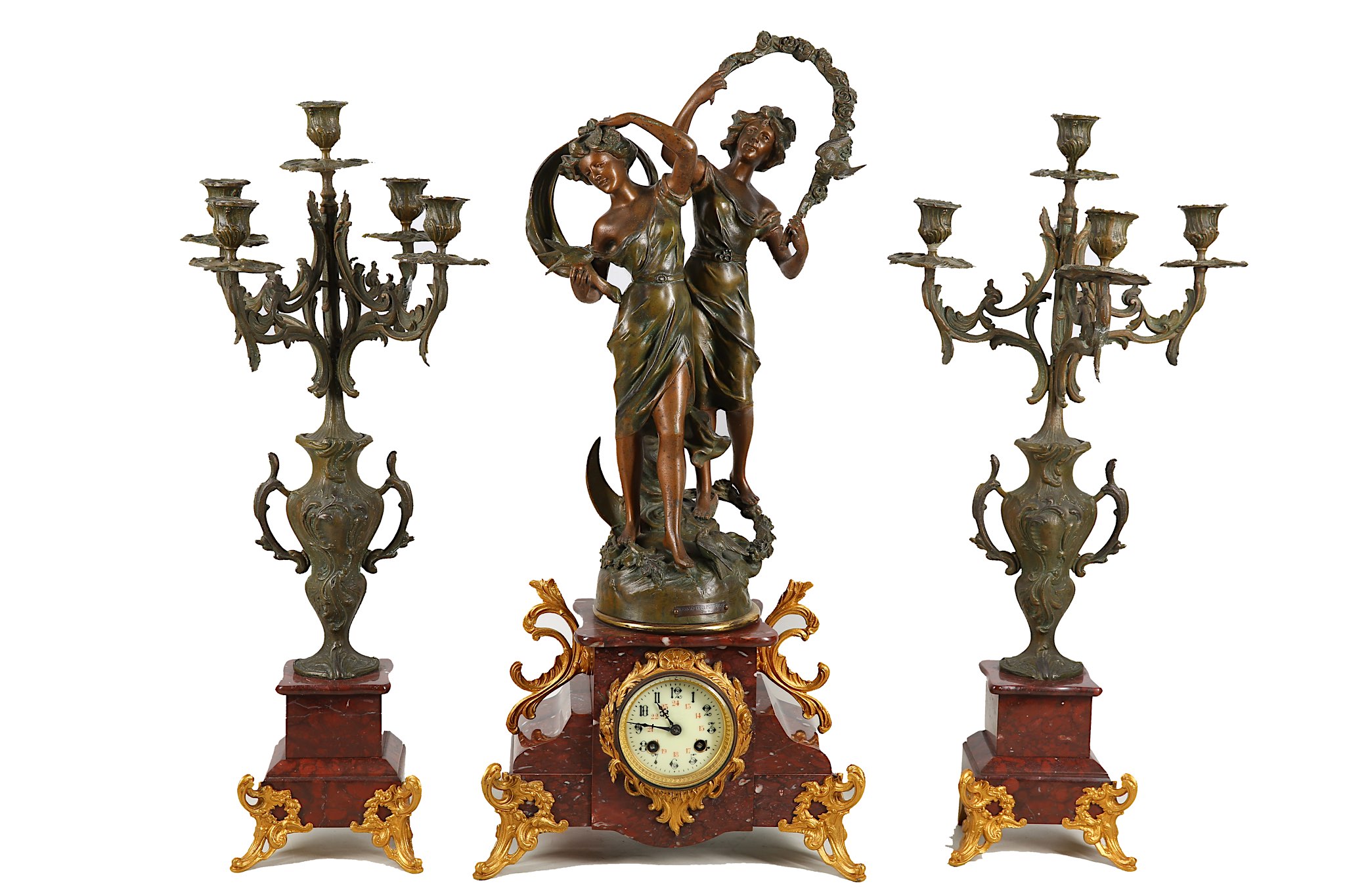 A large French spelter clock garniture