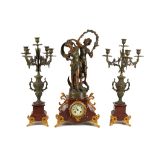 A large French spelter clock garniture