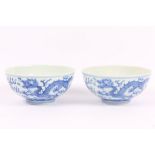 A pair of Chinese blue and white 'dragon' bowls