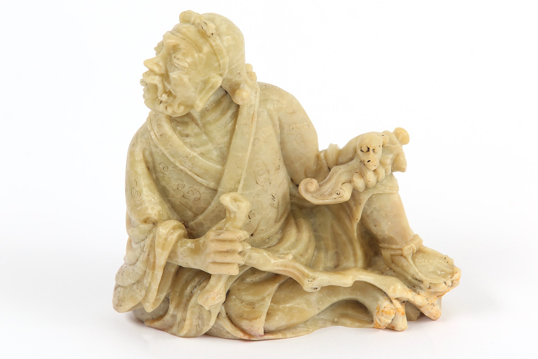 A Chinese carved soapstone figure