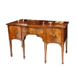 A mahogany serpentine fronted sideboard