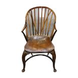 An English elm and beech comb back elbow chair, ci