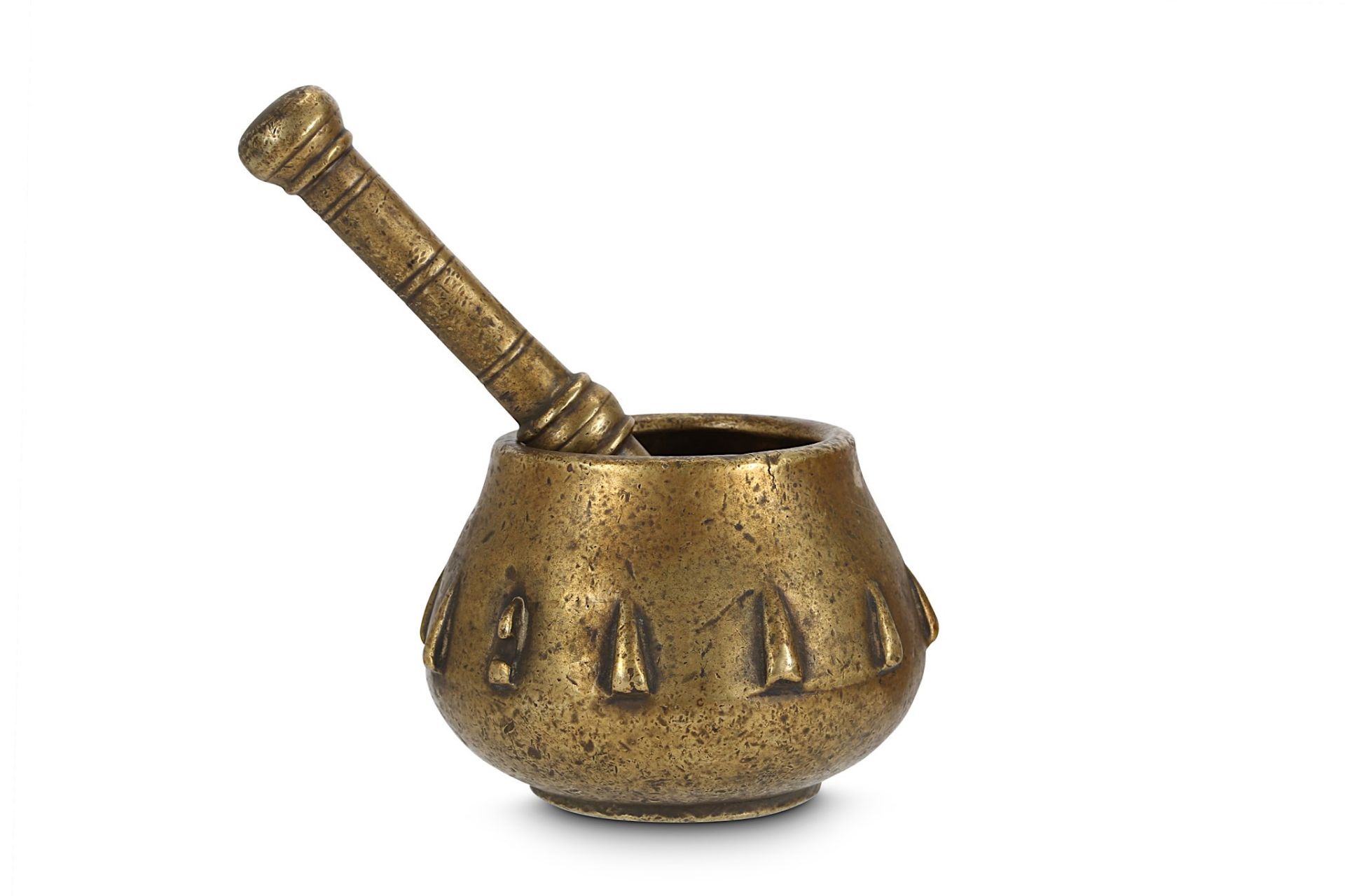 A BRASS MORTAR AND PESTLE Northern India, 18th century  The mortar of bulbous form with slightly