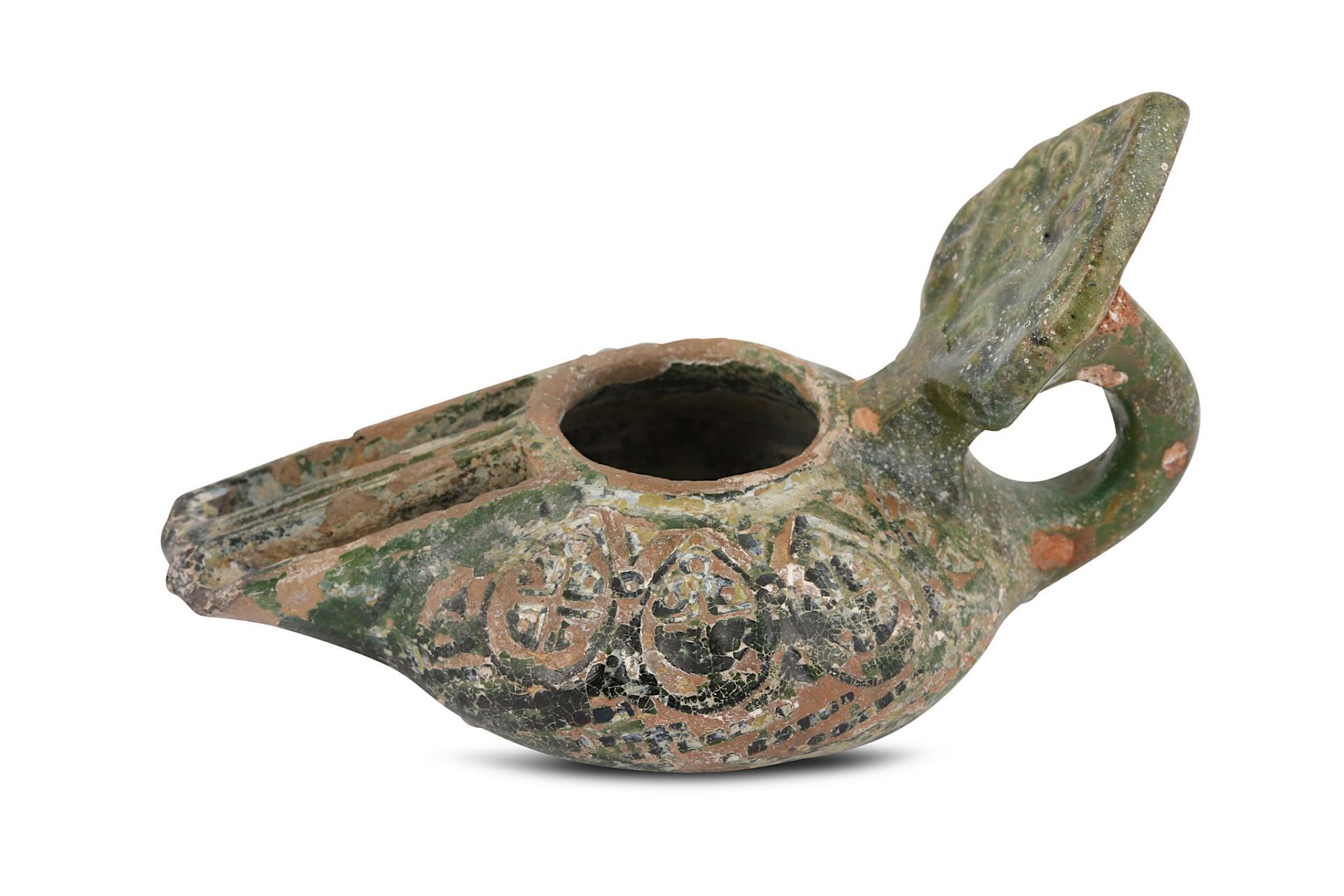 AN EARLY GREEN-GLAZED POTTERY OIL LAMP Possibly Sy