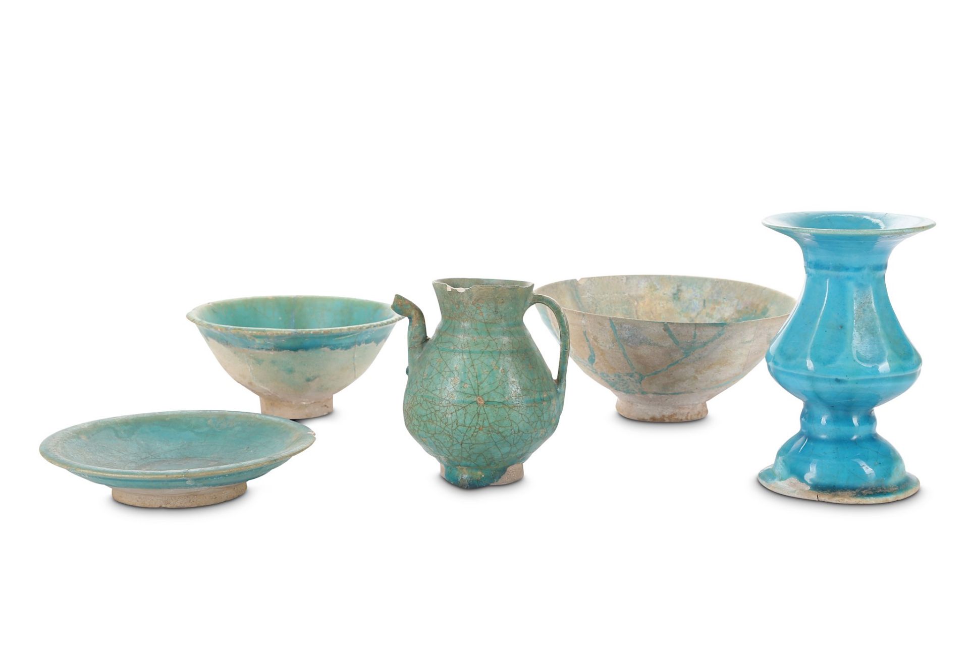 A GROUP OF FIVE TURQUOISE-GLAZED CERAMICS Possibly Kashan, Iran, 12th - 13th century  Comprising two