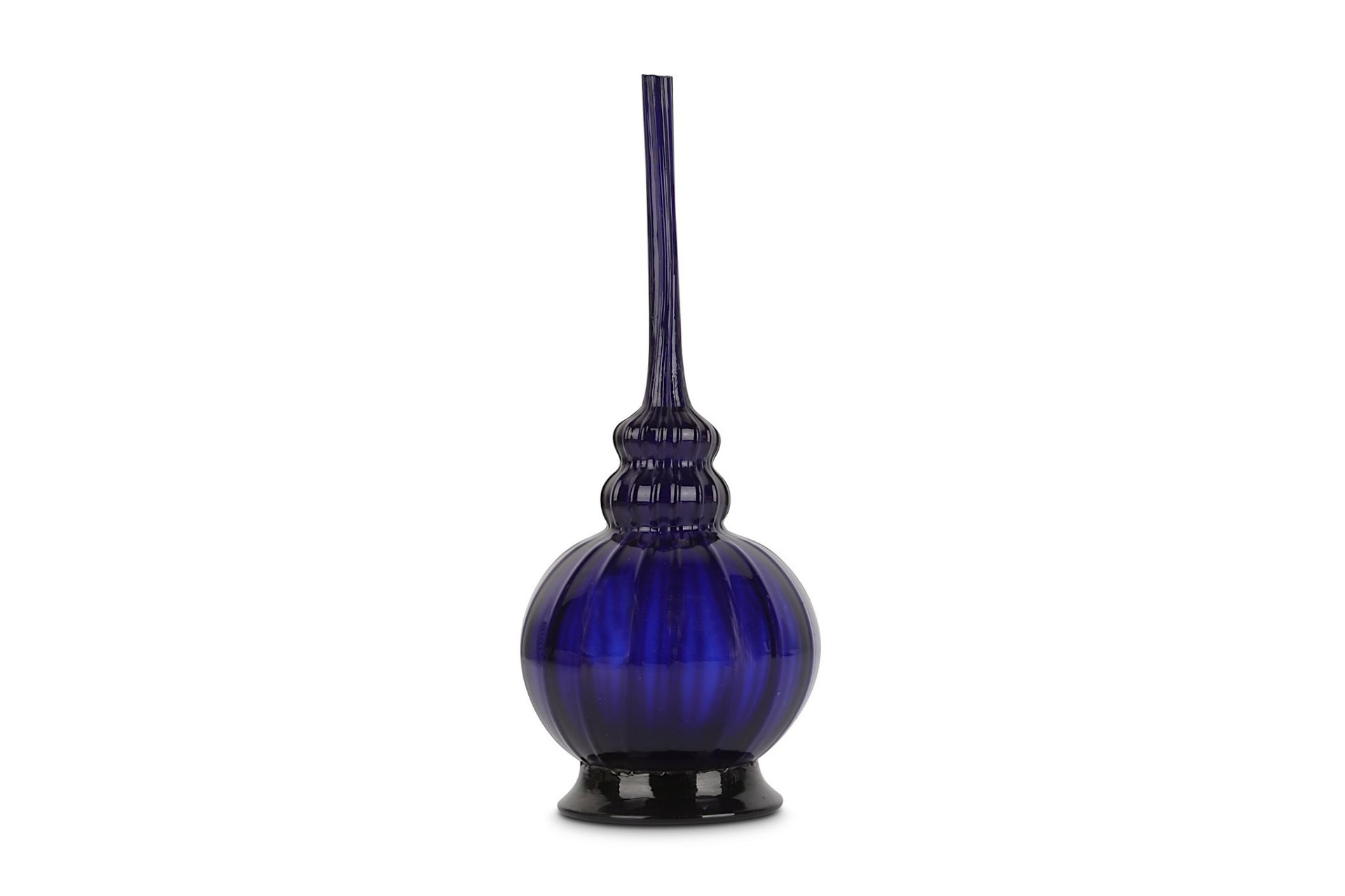 A LATE MUGHAL COBALT BLUE GLASS BOTTLE North India, late 18th - early 19th century Of bulbous shape,