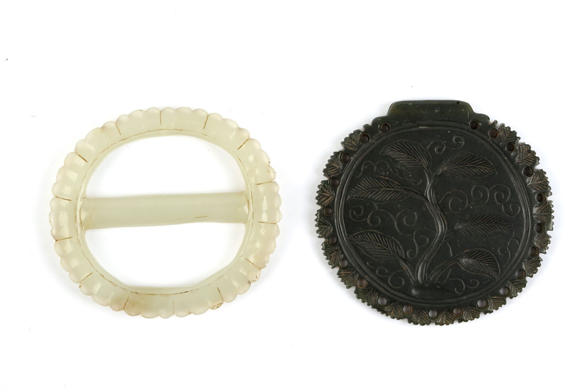 A JADE BELT BUCKLE AND PENDANT Mughal India, 18th - 19th century Comprising a belt buckle of oval - Image 2 of 2