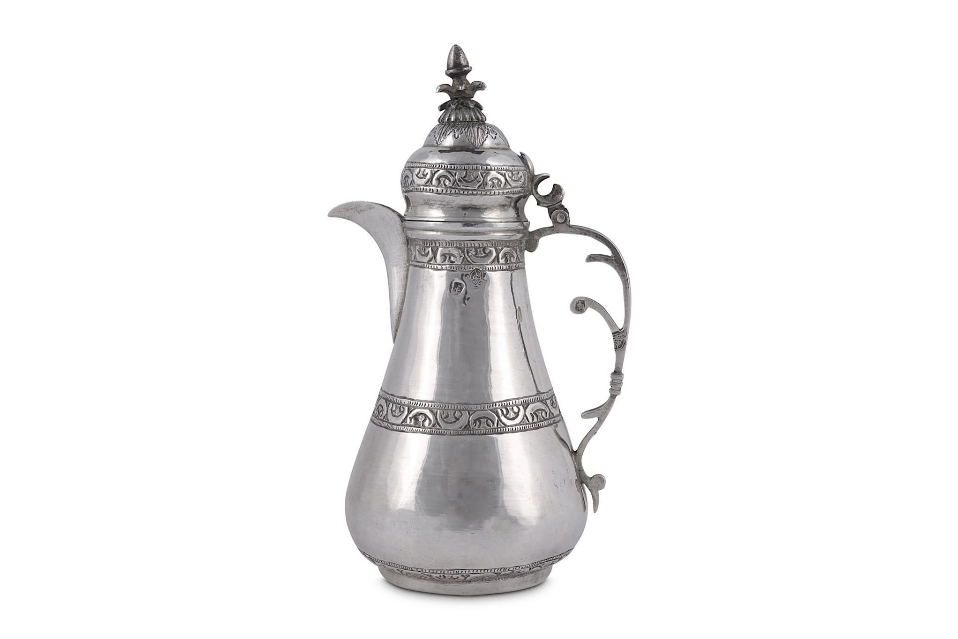 A SILVER COFFEE POT Ottoman Turkey, 19th - 20th century  Of pyriform shape, on short straight