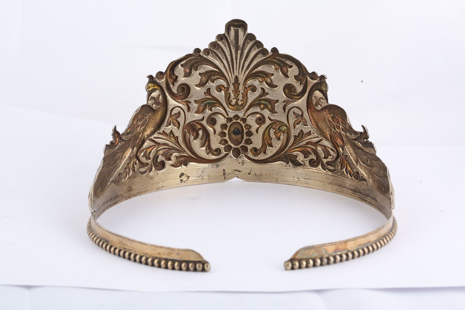 A PARCEL-GILT SILVER TIARA India, 19th century  Of typical circular form, the repoussé decoration - Image 3 of 7