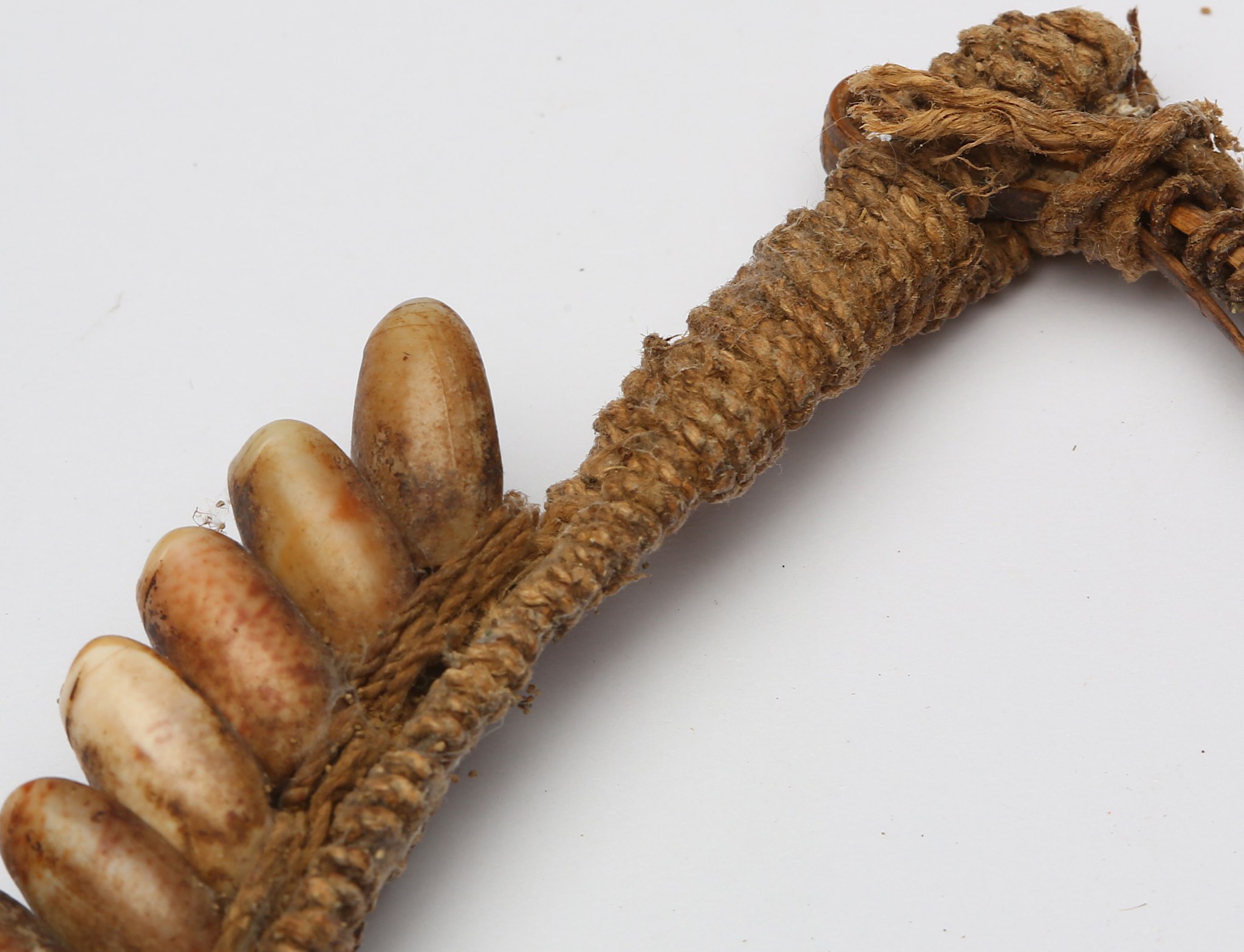 A group of ethnographic objects, including two leaf shaped head and body fibre ornaments for - Image 5 of 12