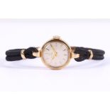 A 1970's-80's Swiss Omega 9ct gold ladies wristwatch, having a plain dial with Roman numerals