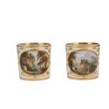 A FINE PAIR OF DERBY PORCELAIN 'NAMED VIEW' COFFEE CANS, circa 1810, both finely painted with