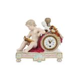 A FINE MEISSEN PORCELAIN FIGURAL CLOCK CASE, circa 1880, modelled as a nude seated putto reading