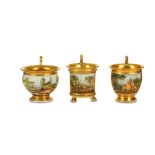 THREE SHAPED PARIS PORCELAIN TOPOGRAPHICAL CUPS, early 19th century, with high gilt scroll