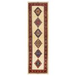 A FINE SIGNED KASHKULI RUNNER, SOUTH-WEST PERSIA approx: 10ft.2in. x 2ft.11in.(309cm. x 89cm.)