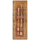 AN ANTIQUE KARABAGH LONG RUG, SOUTH CAUCASUS approx: 11ft.1in. x 4ft.(337cm. x 122cm.) Good bold