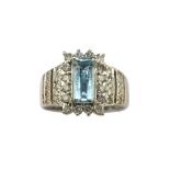 An aquamarine and diamond dress ring