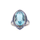 An aquamarine and sapphire dress ring