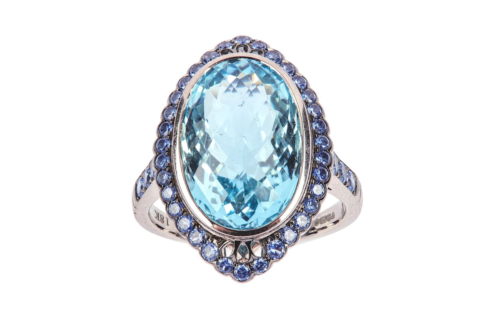 An aquamarine and sapphire dress ring