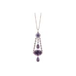 An early 19th century amethyst and seed pearl pendant