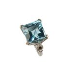 An aquamarine and diamond dress ring