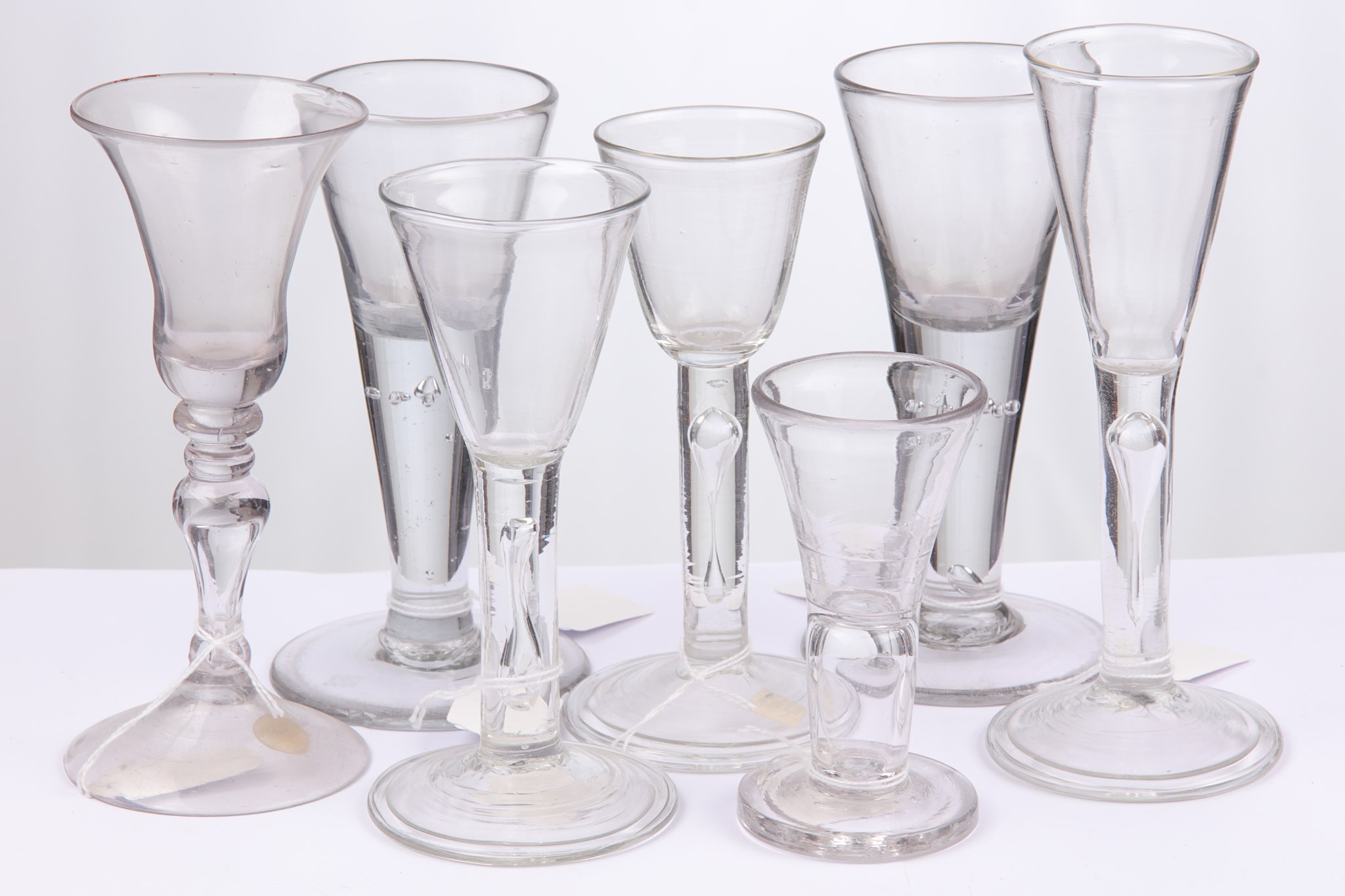 A Dutch baluster wine glass and a collection of pl