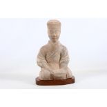 A Chinese earthenware figure of a musician on a wooden base, Han dynasty, 38cm high