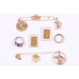 A small collection of jewellery, including two ingots marked "5g 999.9", two rings, and two