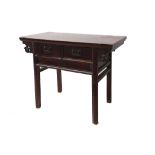 A Chinese lacquered elm side table, the overhanging top fitted with two drawers, on moulded legs,