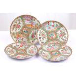 A set of four Canton famille rose porcelain plates, late 19th century, traditionally enamelled in