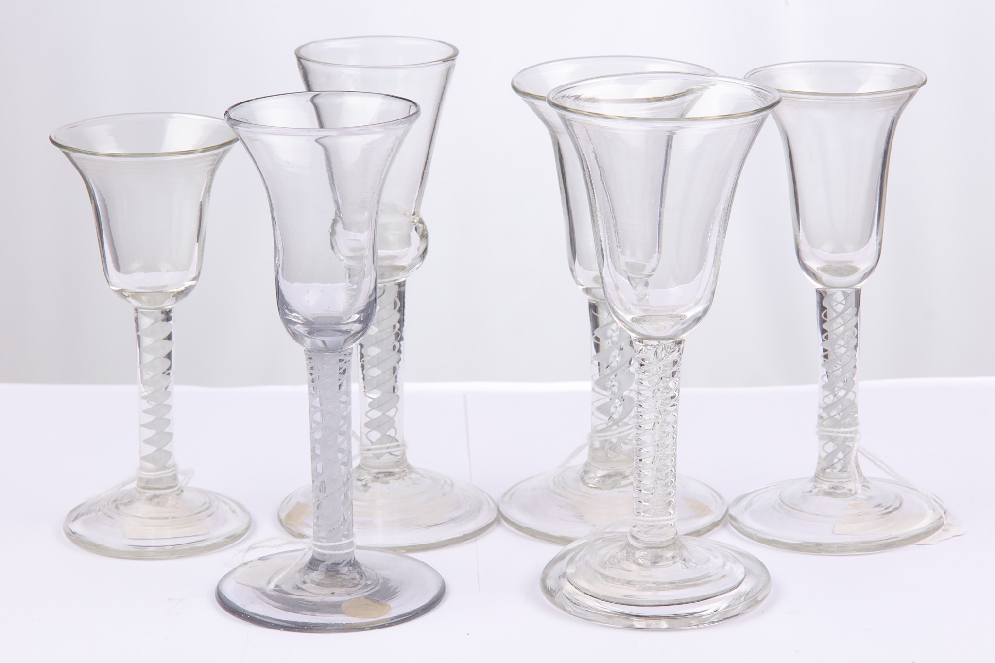 An interesting collection of six wine glasses, fiv