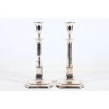 A pair of Old Sheffield silver plated candlesticks, early 19th Century, of large size, on raised