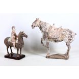 Two Chinese pottery horses, one with rider, Tang style, 41cm and 34cm high (2)