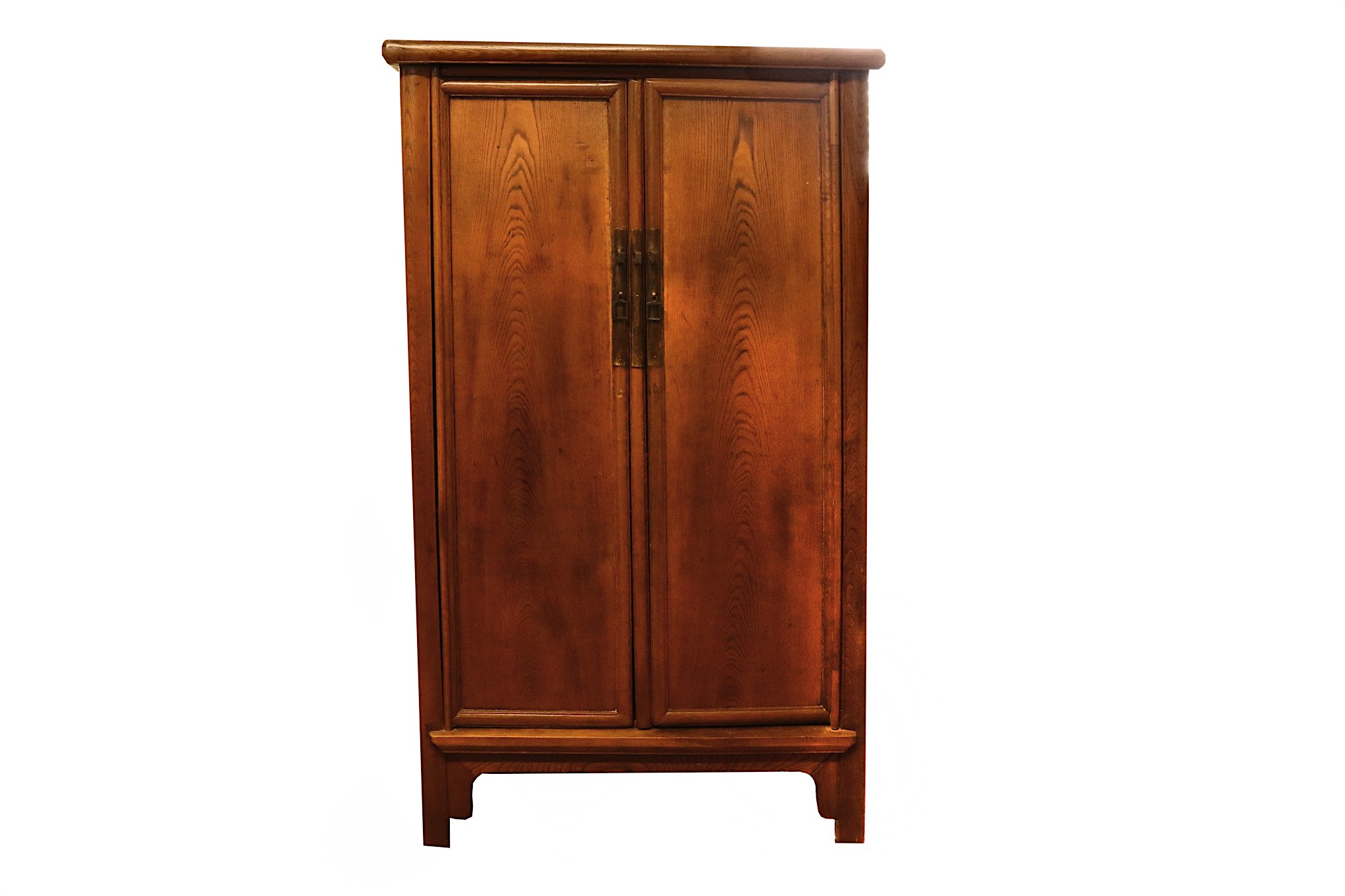 A Chinese hardwood two door hinged cabinet, in Ming style, supported with four legs and square metal