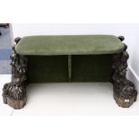 An unusual Victorian cast iron window seat, formerly a pair of gate supports, boldly cast with