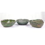 A pair of Chinese twin handled green glazed bowls,